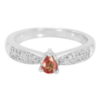 Zilveren ring met een oranje saffier