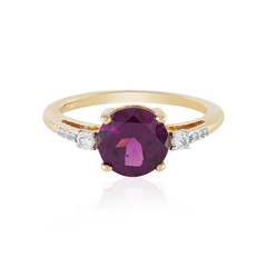 Gouden ring met een magenta granaat